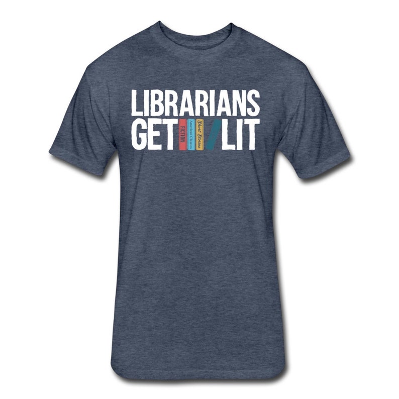 May include: A dark blue t-shirt with the text "Librarians Get Lit" in white. The text is stacked with the word "Get" above the word "Lit".  There are four colorful book spines stacked vertically between the words "Get" and "Lit".