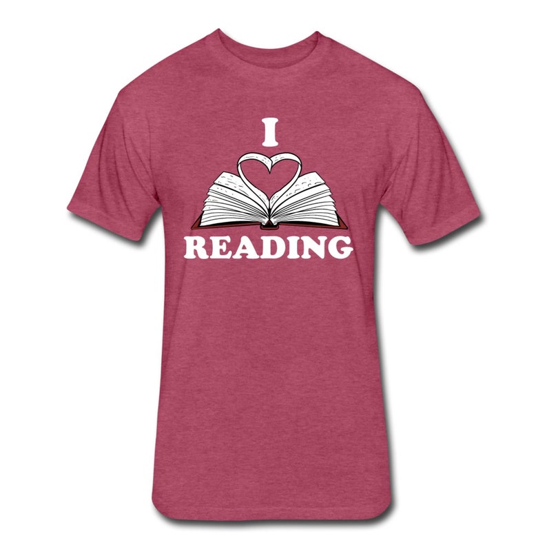 May include: A heather red t-shirt with a white graphic of an open book with a heart shape formed by the pages. The text "I love reading" is printed below the book.