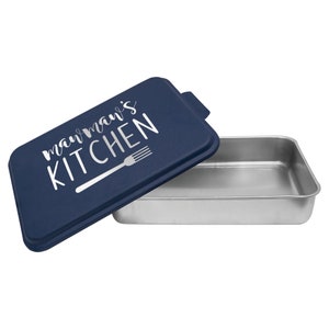May include: A blue baking pan with a lid. The lid has the text "momma's kitchen" in white with a silver fork graphic.