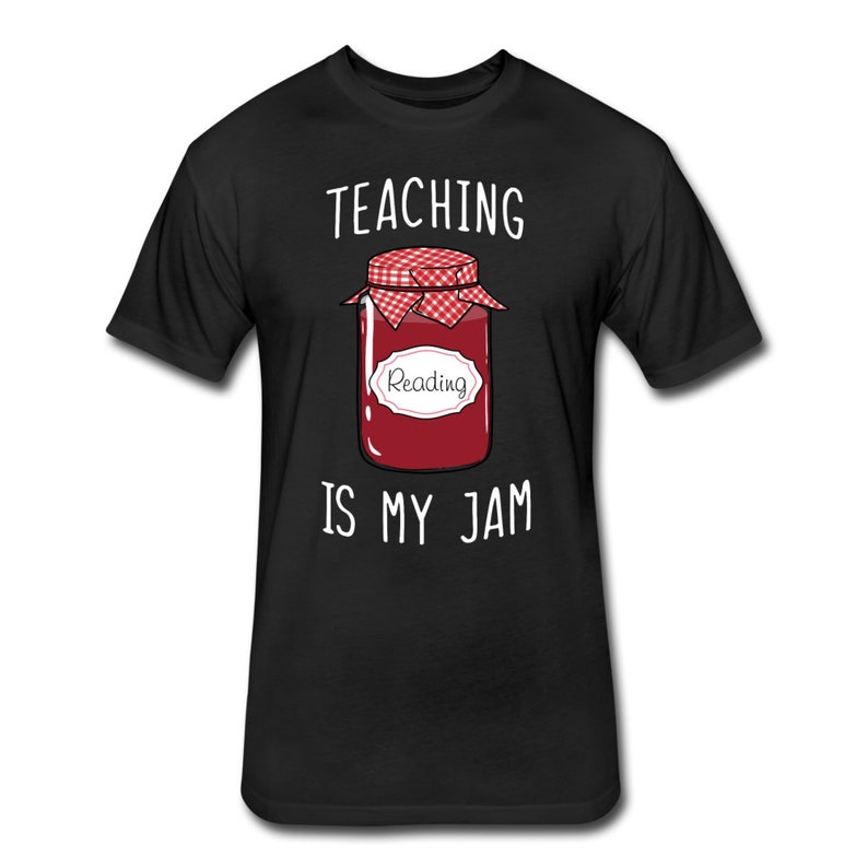 May include: Black t-shirt with white text that reads "Teaching is my jam". A cartoon image of a jar of jam with a red lid and a white label that says "Reading" is in the centre of the shirt.