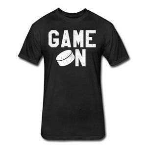 May include: Black t-shirt with white text that reads "GAME ON" and a white hockey puck graphic.