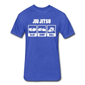 May include: A royal blue t-shirt with the text "JIU JITSU" in white. Below the text are three white boxes with the words "SLAP", "BUMP", and "ROLL" and a simple graphic illustration of each action.