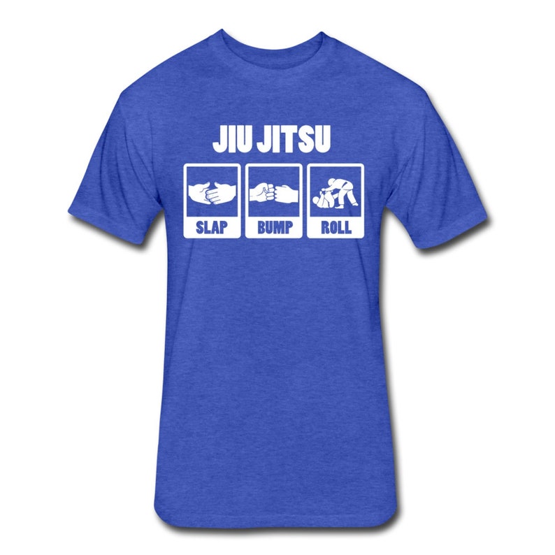 May include: A royal blue t-shirt with the text "JIU JITSU" in white. Below the text are three white boxes with the words "SLAP", "BUMP", and "ROLL" and a simple graphic illustration of each action.