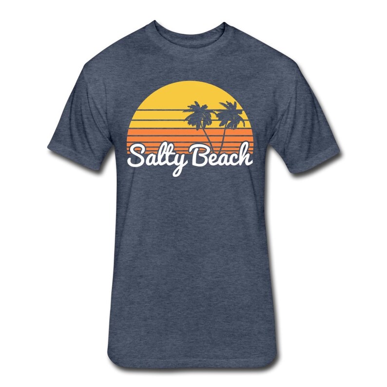 May include: A navy blue t-shirt with a retro sunset graphic featuring two palm trees and the text "Salty Beach" in white.