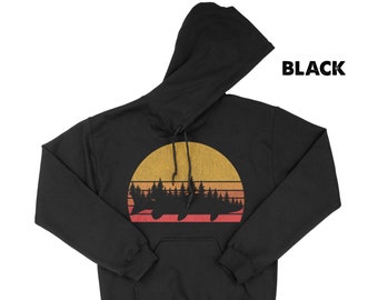Sudadera con capucha Musky - Estampado de pez en bosque de pinos, suave y cálida.