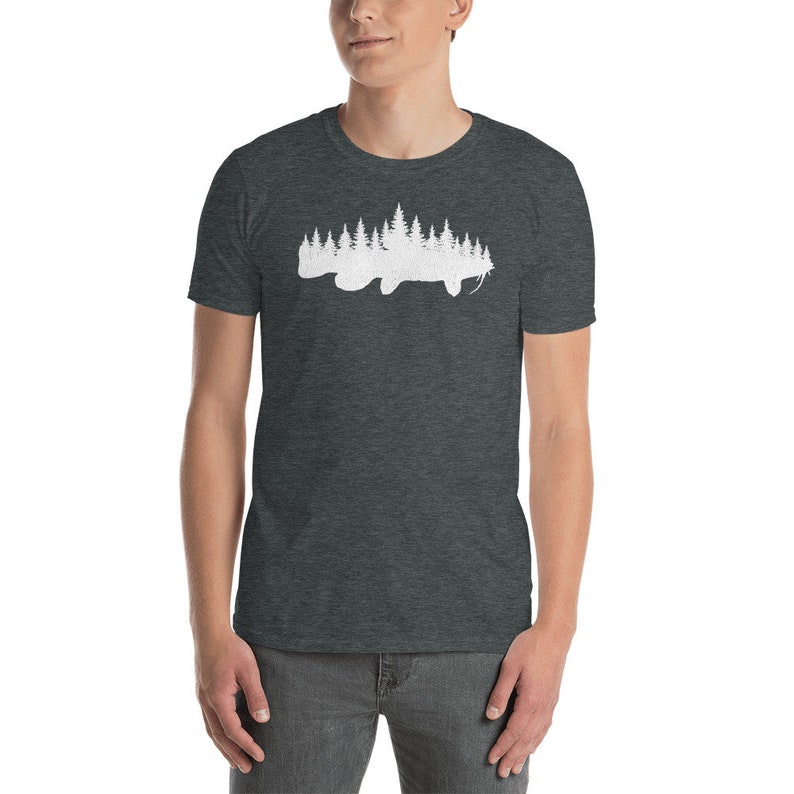 May include: A dark heather grey t-shirt with a white silhouette of a fish made up of trees.