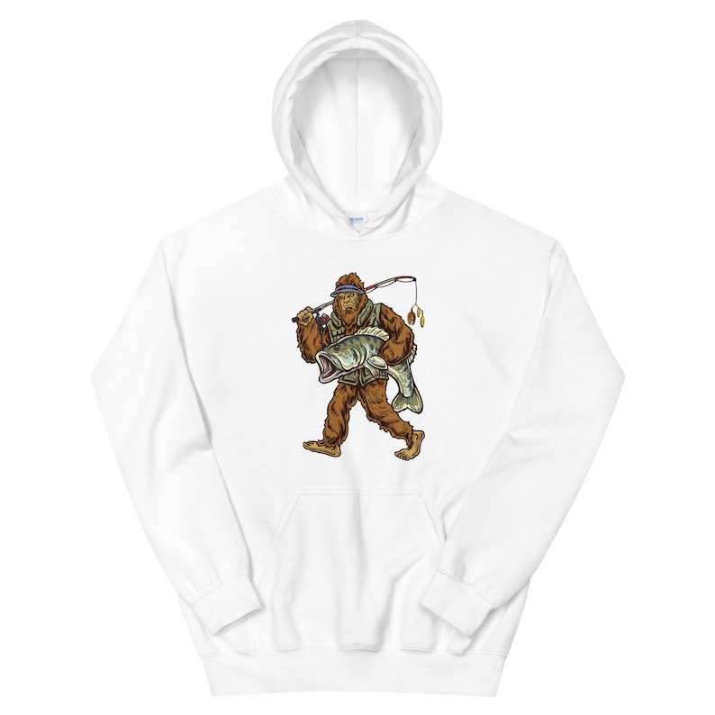 May include: White hooded sweatshirt with a graphic of a Bigfoot holding a fish and a fishing rod. The Bigfoot is wearing a blue headband and a green vest.