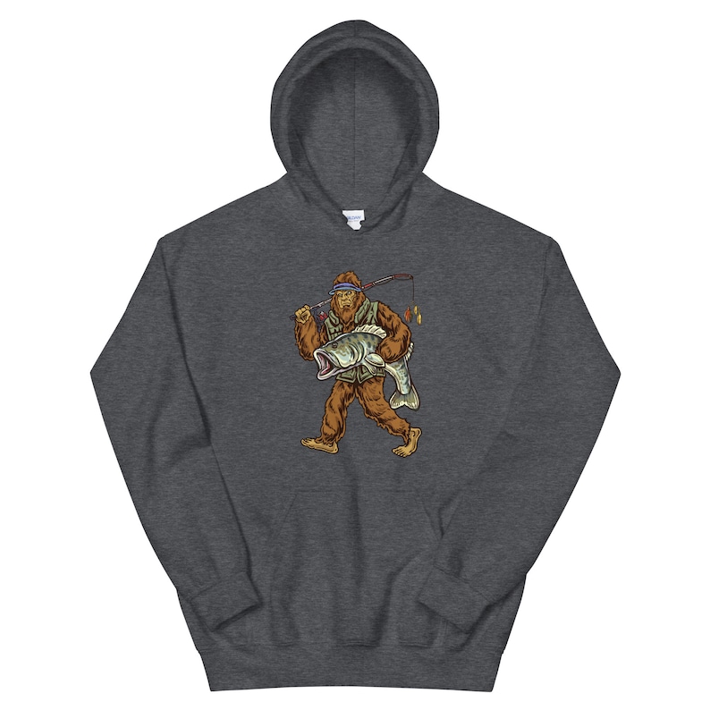 May include: A dark grey hooded sweatshirt with a graphic print of a Bigfoot holding a fish and a fishing rod.