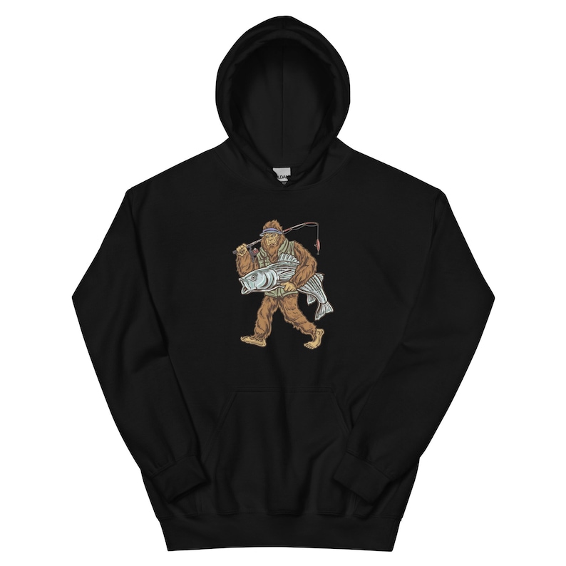 May include: Black hooded sweatshirt with a graphic print of a Bigfoot holding a fish and a fishing rod.