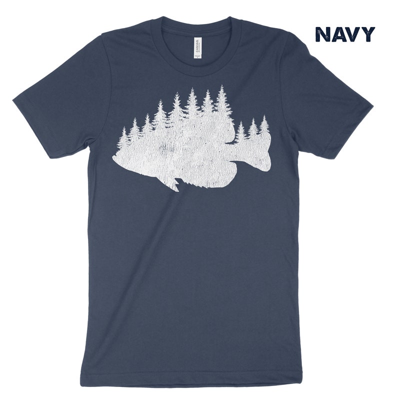 May include: A navy blue t-shirt with a white silhouette of a fish made up of trees.