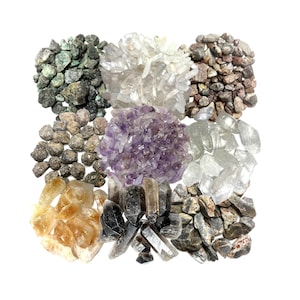 May include: A collection of various crystals and stones, including amethyst, clear quartz, smoky quartz, citrine, and green aventurine. The crystals are arranged in a square shape on a white background.