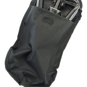 May include: A black folding chair with a carrying case. The chair is folded and stored in the case.