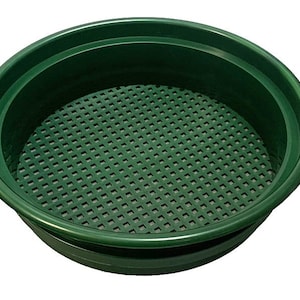 May include: A green plastic panning bowl with a mesh screen insert. The bowl is designed for gold panning and other prospecting activities.