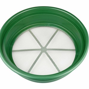 May include: A green plastic panning dish with a white mesh screen. The screen has six spokes radiating from the center.
