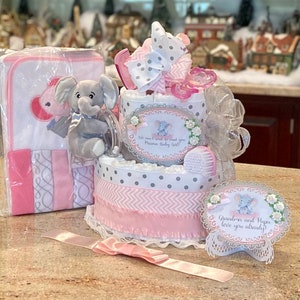 Premium 3 Tier Pink Elephant Diaper Cake with Stuffed Elephant, Pacifiers, Brush/Comb, Towel/Washcloth Set, and Complementary Cake Topper