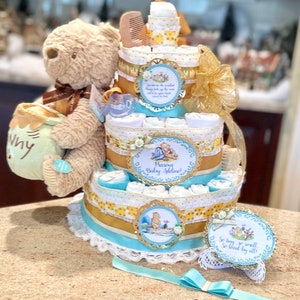 Premium 4 Tier Musical Winnie the Pooh Diaper Cake With Stuffed Winnie Bear, Pacifiers, Brush/Comb, Washcloths, Theme Signs and Cake Topper