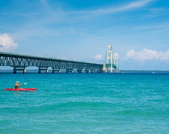 Man Canoeing by Mackinaw Bridge