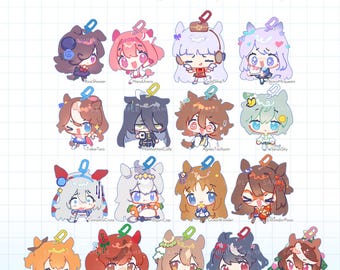 May include: A collection of sixteen 2-inch acrylic character keychains with U-shaped clasps, featuring various anime-style figures with names printed below each. The grid layout displays colorful, chibi-style illustrations on a light blue grid background.