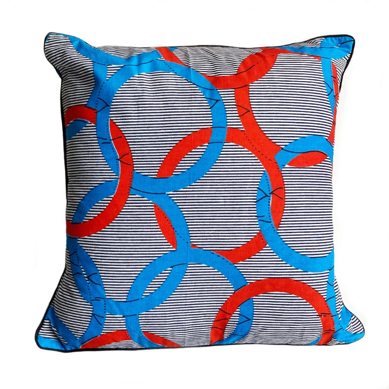Brightly coloured African print cushion in blue decorative white and red