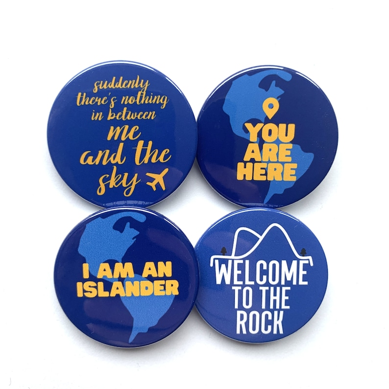 May include: Four blue round buttons with white text and yellow accents. The buttons feature phrases related to the island of Oahu, Hawaii. The phrases are "suddenly there's nothing in between me and the sky", "You are here", "I am an islander", and "Welcome to the rock".