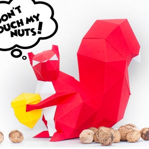 May include: A red origami squirrel holding a yellow acorn with a thought bubble above its head that says "Don't touch my nuts!"