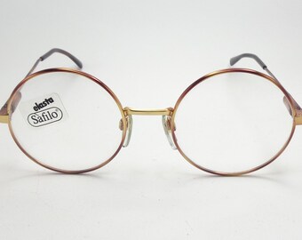Safilo Elasta vintage jaren 1980 bril dames dames Nieuwe Oude Voorraad intense gouden kleur met gele gaten Accessoires Zonnebrillen & Eyewear Leesbrillen 