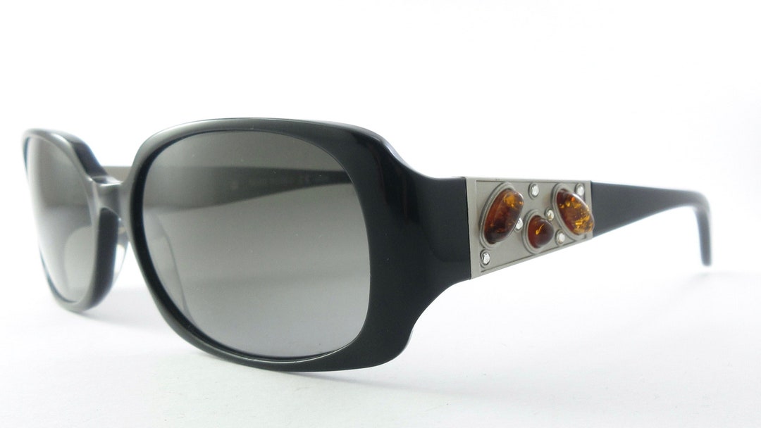 DESIGN - Occhiali da sole squadrati neri con lenti color ambra