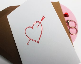 Letterpress wedding greeting card with 2 hearts bound by cupid's arrow. Engagement card, valentines card, anniversary card.