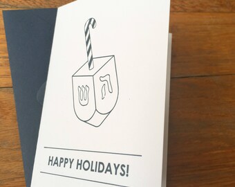 Happy Holidays greeting card blue letterpress Hanukkah card featuring Dreidel / Candy Cane combination