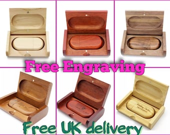 May include: Six wooden USB flash drives in different wood finishes, each in a matching wooden box. The boxes are open and the USB drives are visible. The text "Free Engraving" is displayed in pink letters above the boxes. The text "Free UK delivery" is displayed in green letters below the boxes.