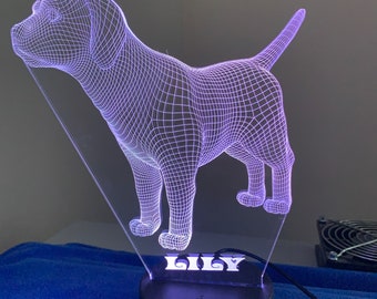 May include: A purple 3D printed dog night light with a black base and a power switch. The light is on and the dog's name "Lily" is printed on the base.