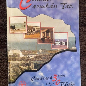 May include: A blue and white book cover with the title "Comhar Caomhan Teo." and the text "Comoradh 30 Bliain 1971 2001". The cover features a collage of images of a small town.