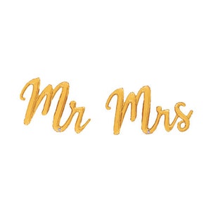 May include: Gold foil balloons spelling "Mr. Mrs." for a wedding or engagement party.