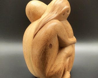 Beautiful pair of lovers made of Sawo wood, handmade in Bali, hand-carved from solid wood