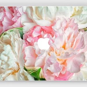 May include: Close-up of a bouquet of pink and white peonies. The peonies are arranged in a cluster, with the petals overlapping and creating a soft, romantic look. The image is perfect for a floral design or a romantic theme.