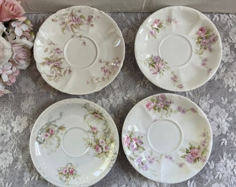 Pretty set of (4) Theodore Haviland mismatched saucers