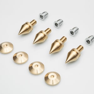 Brass spike set for speaker systems and vinyl record player shelves and subwoofers, complete with locknuts and stand.