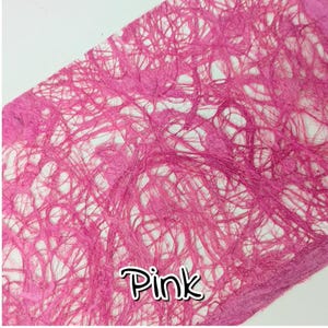 May include: Close-up of pink fibrous paper with a web-like texture. The word "Pink" is written in a white and black outlined font in the lower right corner. The paper has a rough, handmade appearance.