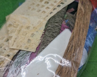 Paper OFF CUTS, 50g bag,  great for scrapbooks and journaling, includes beautiful papers, and bark and plant material papers.