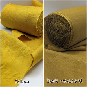 May include: Two rolls of fabric, one yellow and one dark mustard. The yellow fabric is unrolled, showing its texture. The dark mustard fabric is rolled up. The words "Yellow" and "Dark mustard" are written on the image.