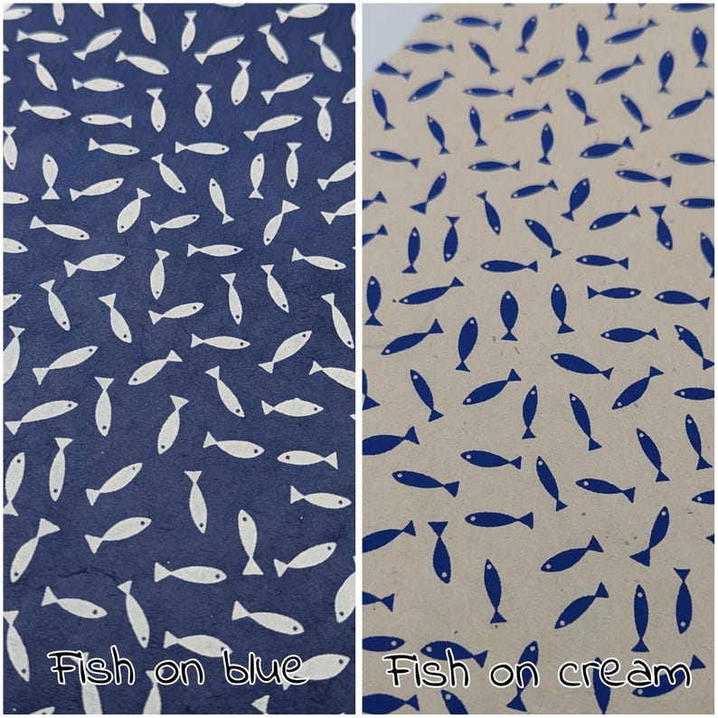 May include: Two patterned papers, one navy blue and one cream, each covered in a repeating pattern of stylized fish. The navy paper has white fish, while the cream paper has blue fish. Text at the bottom reads "Fish on blue" and "Fish on cream."