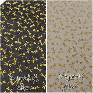 May include: Two patterned papers, one black with yellow dragonflies and the other beige with yellow dragonflies. The text "Dragonfly Black" and "Dragonfly yellow" are written on the bottom of each paper.