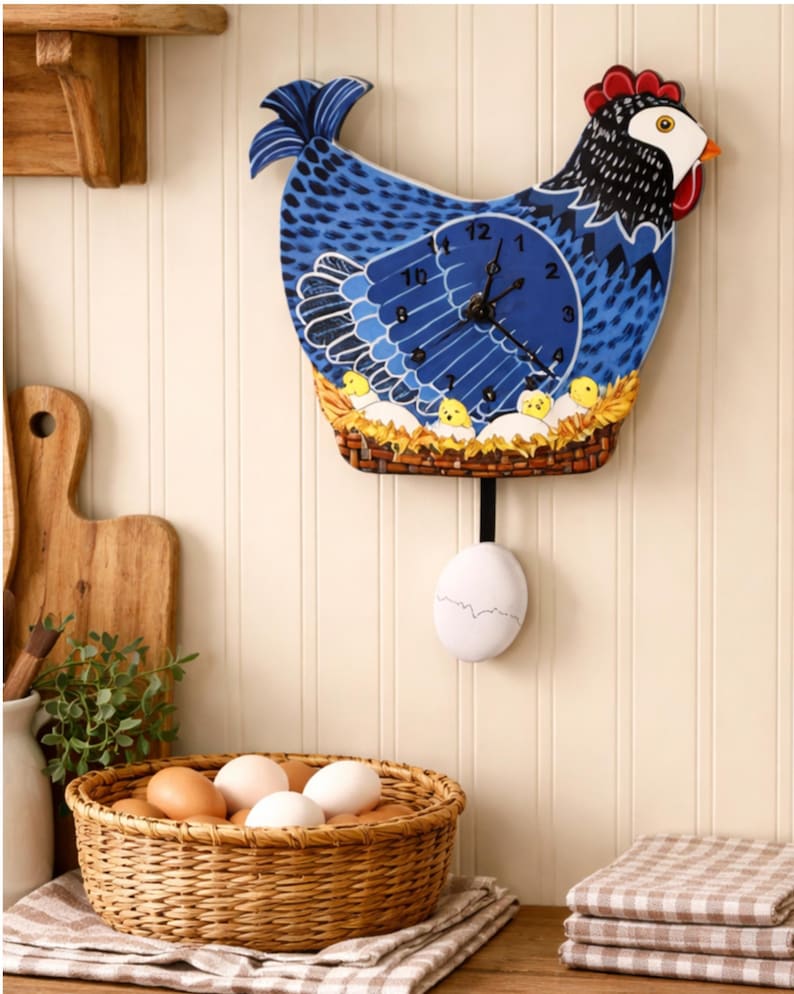 May include: A whimsical blue chicken-shaped wall clock with a pendulum egg. The clock face is a blue circle with black hands and white numbers. The clock has a red comb and a basket with yellow chicks. A basket of eggs sits below.