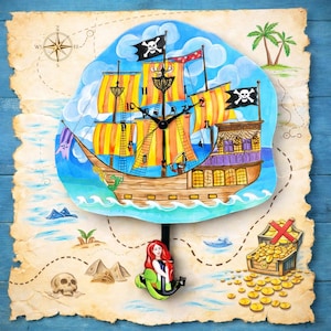 May include: A whimsical pirate ship clock with a pendulum featuring a mermaid. The clock face depicts a pirate ship with orange and yellow sails, set against a blue sky. The clock is mounted on a map with a treasure chest and skull.