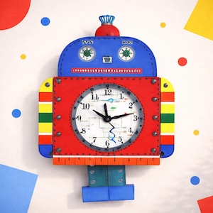 May include: A colorful robot-shaped wall clock with a red body, blue head, and blue and green legs. The clock face is white with black numbers and hands. The clock is decorated with bolts and colorful stripes.
