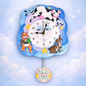 May include: A whimsical wall clock featuring a smiling moon face with a cow, cat, and dog. The clock has a blue cloud-shaped frame with stars and a pendulum. The clock hands point to 9:58.