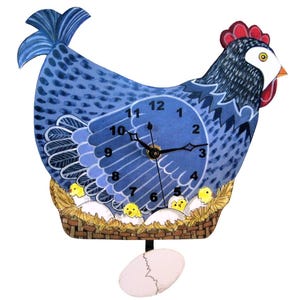 May include: A whimsical wall clock shaped like a blue hen with a red comb. The clock face is integrated into the hen's body, displaying black numbers. A basket with yellow chicks and eggs sits below the clock face, with a cracked egg pendulum.