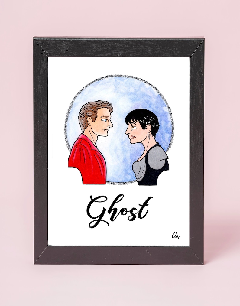 May include: A framed illustration of a man and woman in a romantic scene. The man is wearing a red shirt and the woman is wearing a black and gray outfit. The background is a blue watercolor circle with the word "Ghost" written in black below the image.