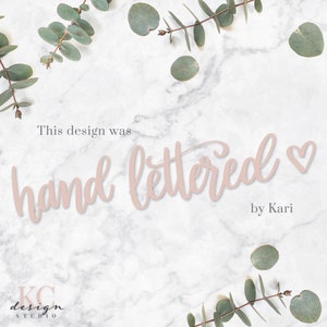 May include: A white marble background with green eucalyptus leaves around the edges. The text "This design was hand lettered by Kari" is written in pink cursive font.