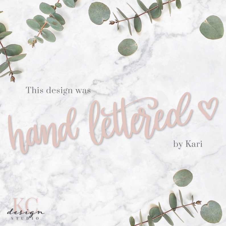 May include: A white marble background with green eucalyptus leaves around the edges. The text "This design was hand lettered by Kari" is written in pink cursive font.